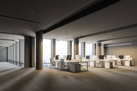 宽敞的灰色墙壁办公室内部有一层混凝土地板阁楼窗户和一排电脑桌。侧面视图。3d 渲染模拟