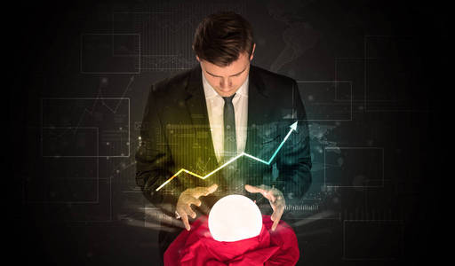 商人用魔术球预测股票市场的未来照片
