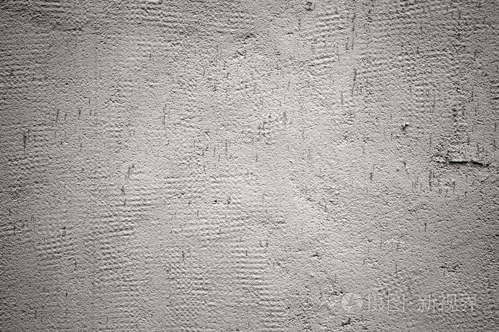 用石膏覆盖的灰色旧墙的特写.灰色背景