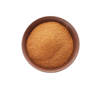 碗苹果片一张旧木桌上加糖的肉桂粉甜甜圈与咖啡,杯子堆放在一个圆圈