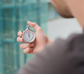 Man Holding A Stopwatch