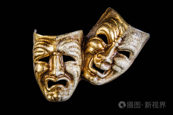 黑色背景下的两个面具微笑和悲伤