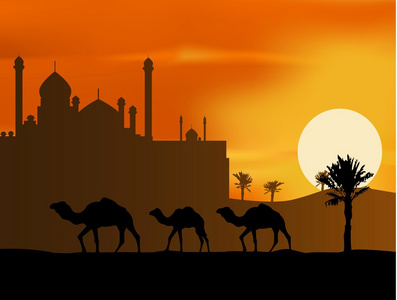 骆驼之旅剪影与美丽的清真寺背景