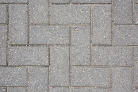 地面图案地面路面上的混凝土瓦片抽象图案纹理背景顶部拍摄照片