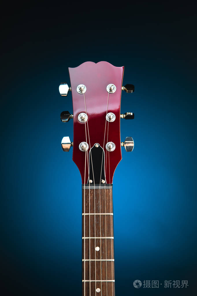 电吉他头蓝色背景