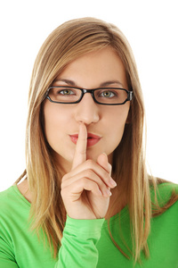 保持安静女人使保持它安静的手势照片