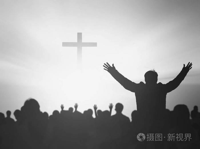 基督教祈祷的剪影举手祷告耶稣