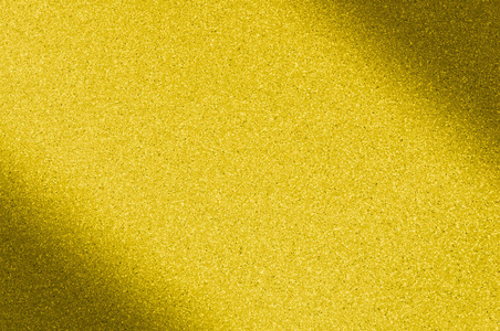 花岗岩背景金黄颜色与小点.左, 右对角变暗.模糊照片