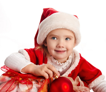 圣诞礼品盒和球帽的小女孩