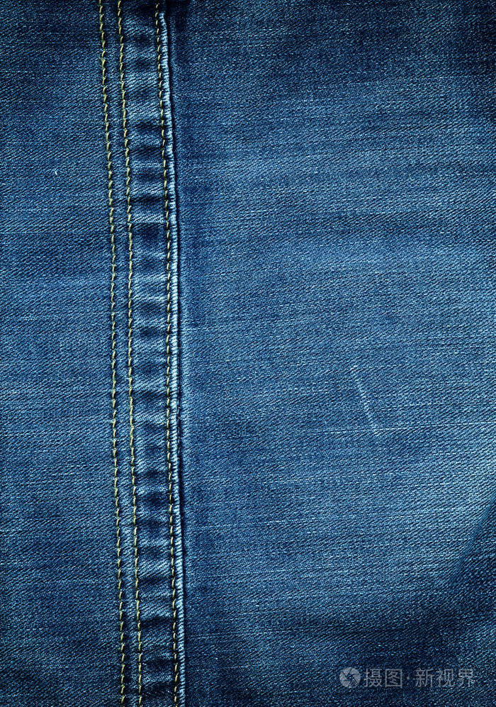 缝合带纹理的蓝色牛仔裤牛仔面料背景