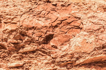 古被毁花岗岩的红色浮雕质地地质抽象背景