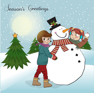 两个快乐的女孩在堆雪人插图图片