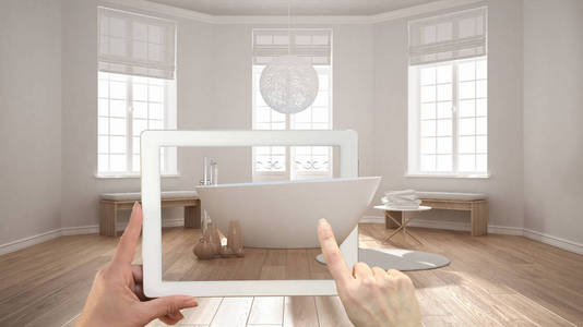 增强的现实概念。手持平板电脑用于模拟家具和室内设计产品在真正的家庭, 简约水疗浴室