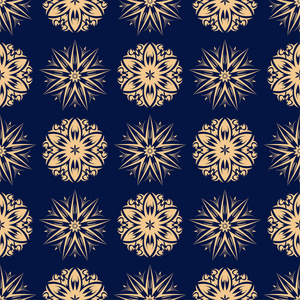 金色的花朵点缀在深蓝色的背景。纺织品和墙纸无缝图案