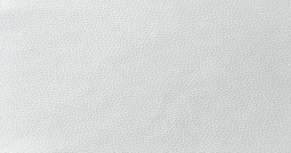 米色皮革质地, 白色母牛皮肤为背景照片