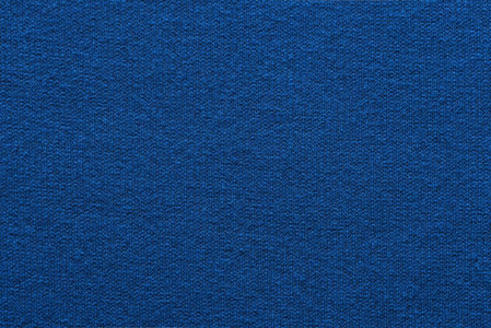 空白和干净的背景或墙纸与抽象针织纹理的织物或纺织材料的特写蓝色