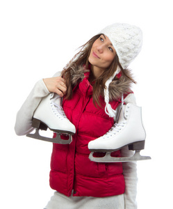 年轻女子举行冬季滑冰的溜冰鞋