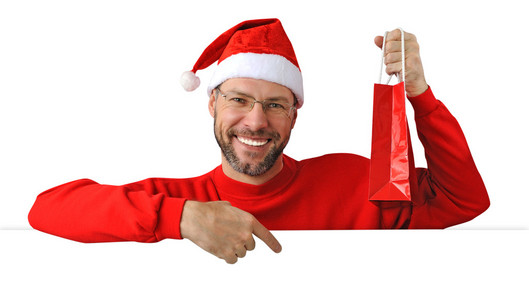 微笑着戴上白色隔离着圣诞老人帽子圣诞节男人