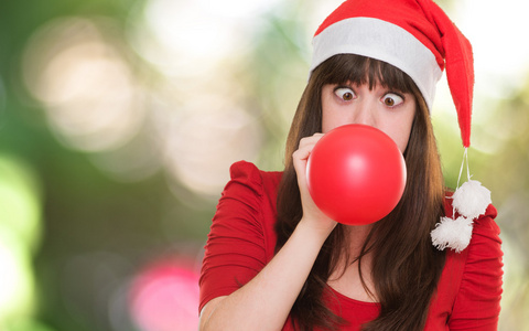 圣诞女人与她的眼睛越过吹气球