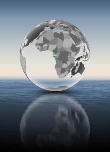 加蓬在水面上半透明的地球仪上有旗帜。3d 插图