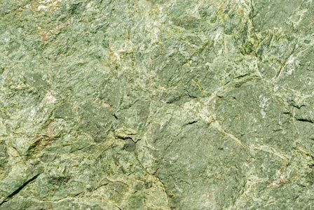 背景, 纹理-粗糙表面的悬崖从蛇纹岩, 天然石材与绿色色调照片