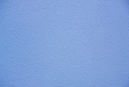冷蓝色粗糙灰泥墙壁纹理的相片照片