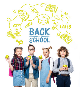 微笑的小学生抱着成熟的苹果, 白色的, 图标和 回到学校 字样