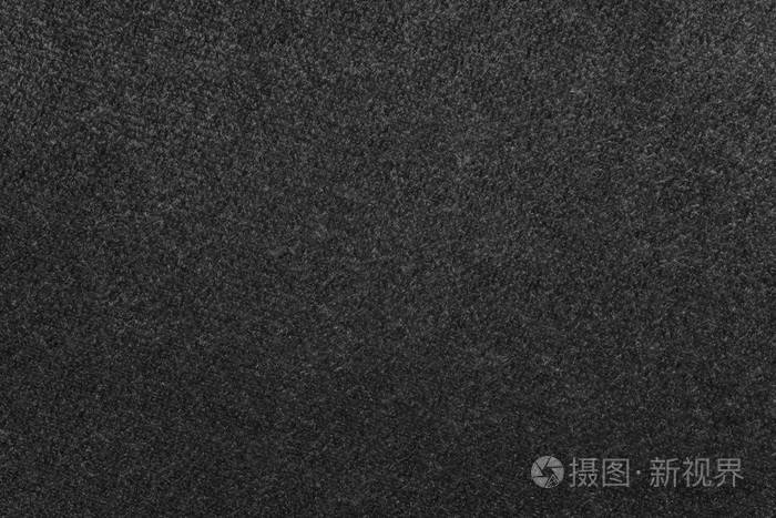 为抽象纹理背景或墙纸的黑色天鹅绒织物的macrophotography