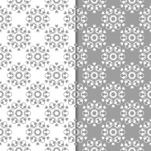 白色和灰色的花卉背景。纺织品和墙纸的无缝图案集