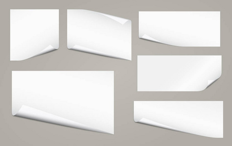 灰色背景下的文本或广告信息的卷曲角的白色笔记本纸集
