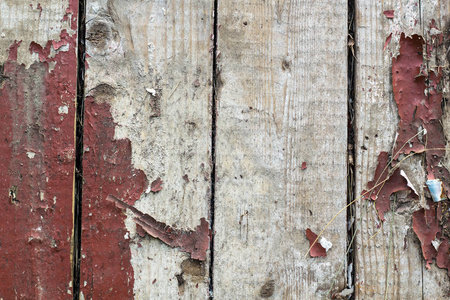 老木背景与遗骸的片断老油漆在木头上