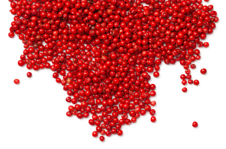 胡椒粉种子粉色胡椒粉红色胡椒在白色背景下分离.顶部视图照片