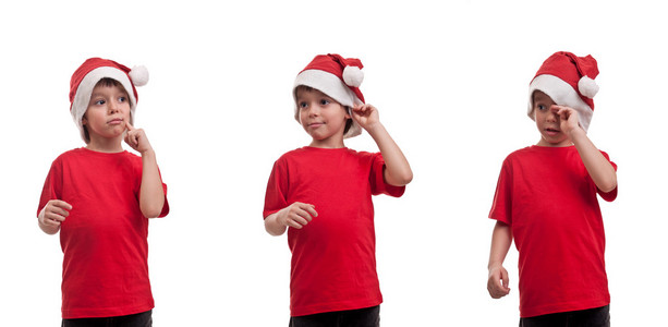 快乐的孩子与圣诞帽子和各种表达式野芭蕉