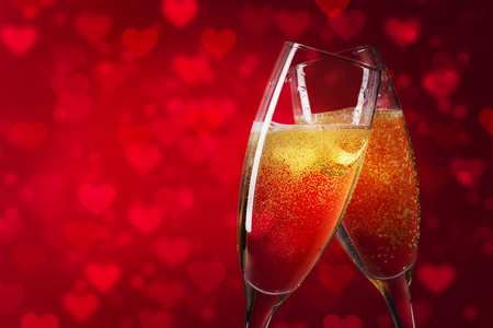 快乐情人节红色的心背景和两个香槟眼镜