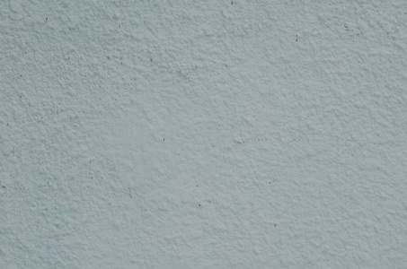 老式水泥背景墙上的裂缝和孔洞与多层的油漆