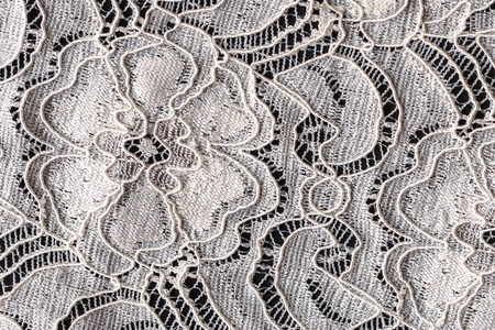 花卉蕾丝蕾丝与花卉图案在黑色的背景,特写照片