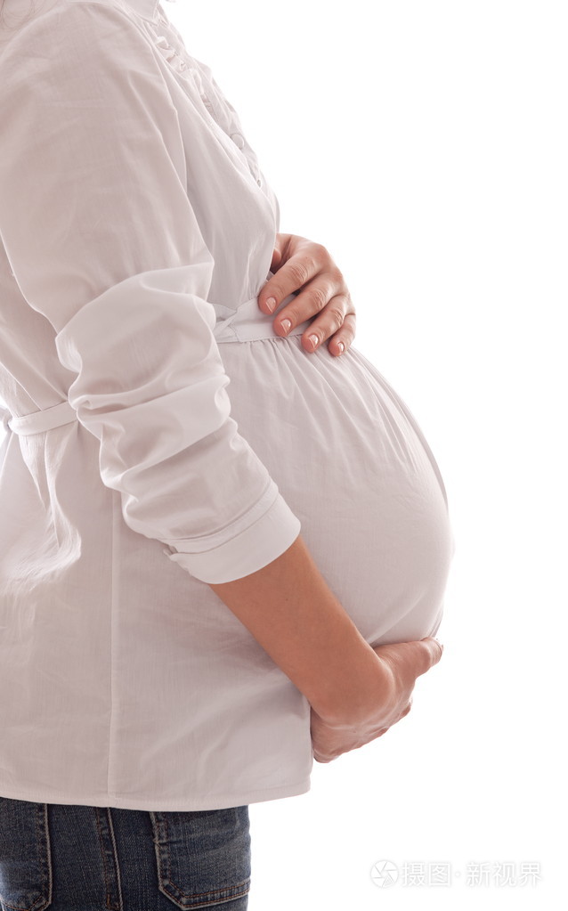 孕妇保持的手在她的肚子上照片-正版商用图片06c2dx-摄图新视界