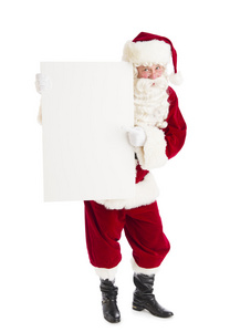 圣诞老人指着空白广告牌图片