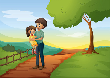 一个父亲背他的女儿在小山图片