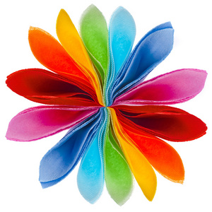 彩色的纸餐巾孤立在白色背景上的装饰彩虹花照片
