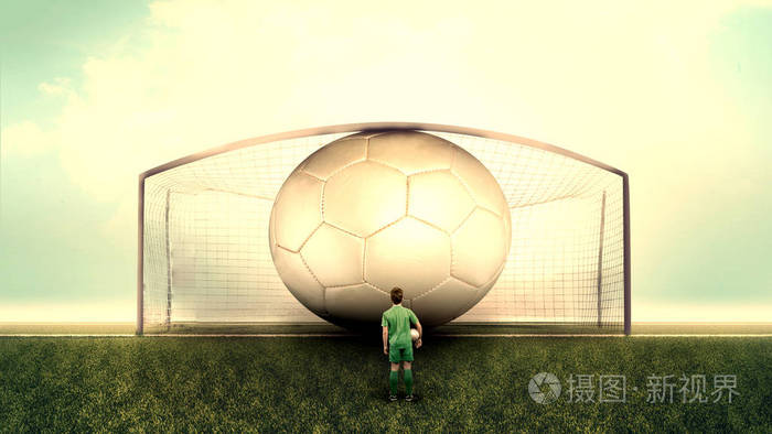 足球运动员在球场上看着一个超大的球在球门