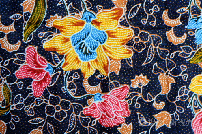 多彩蜡染布织物背景