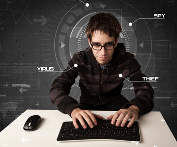 入侵信息年轻的黑客黑客入侵个人信息的未来派环境中照片