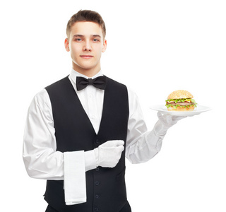 年轻的微笑着服务员板上持有的汉堡
