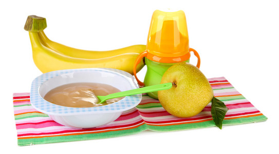 美味宝宝水果原浆和婴儿奶瓶的白色上孤立