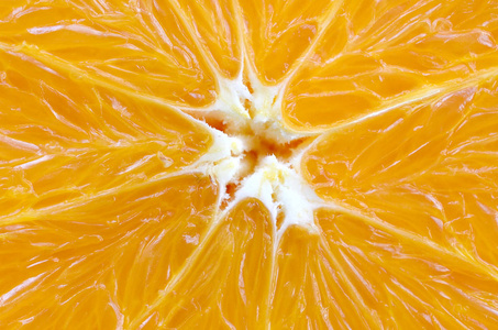 橙色水果片的一个片断的顶部视图关闭。宏背景纹理