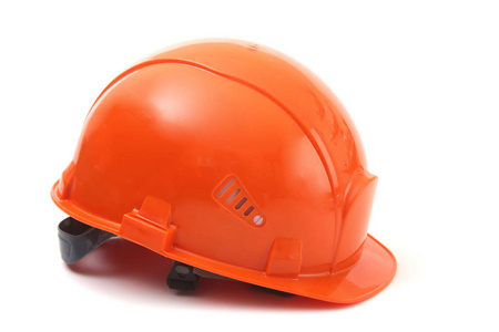 白色背景的工作者橙色坚硬帽子。安全帽