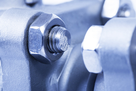 由机械棘轮螺栓和螺母制成的金属网络或机器人的握手测量的螺栓和螺母