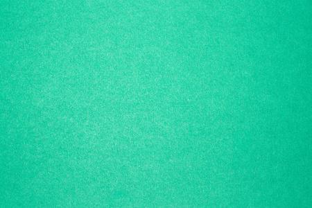 彩色纸板的蓝绿色背景