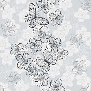 鲜花和蝴蝶在灰色背景下的手图片